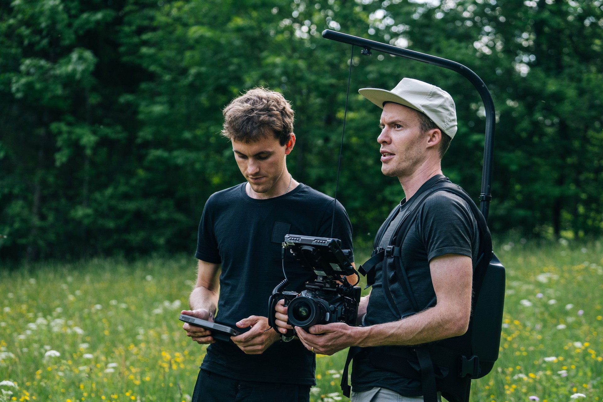 Cinematographers work together with filming equipment